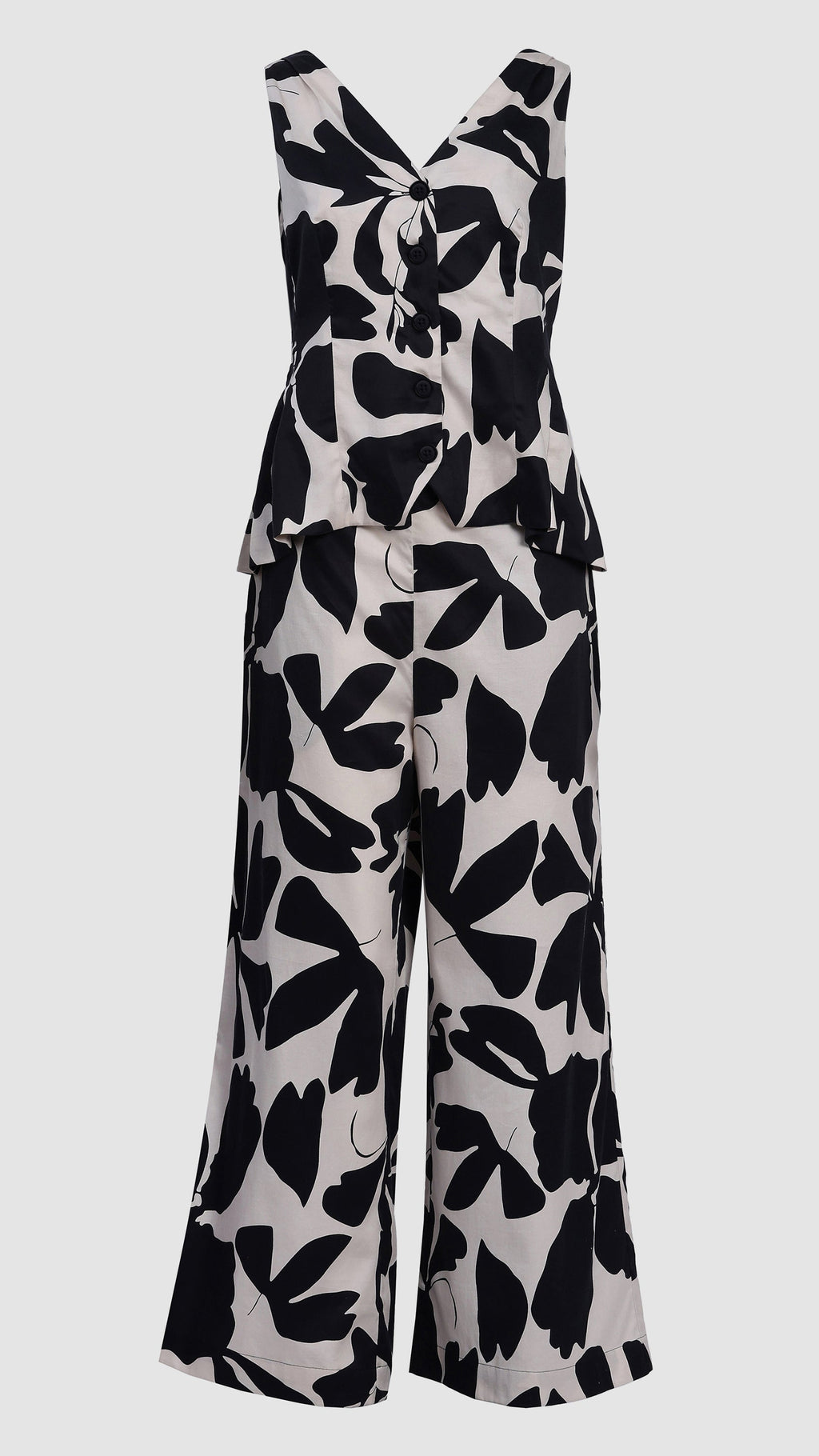 Black and white floral patterned jumpsuit on a light gray background