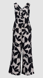 Black and white floral patterned jumpsuit on a light gray background