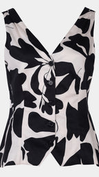 Black and white floral patterned sleeveless top on a light gray background