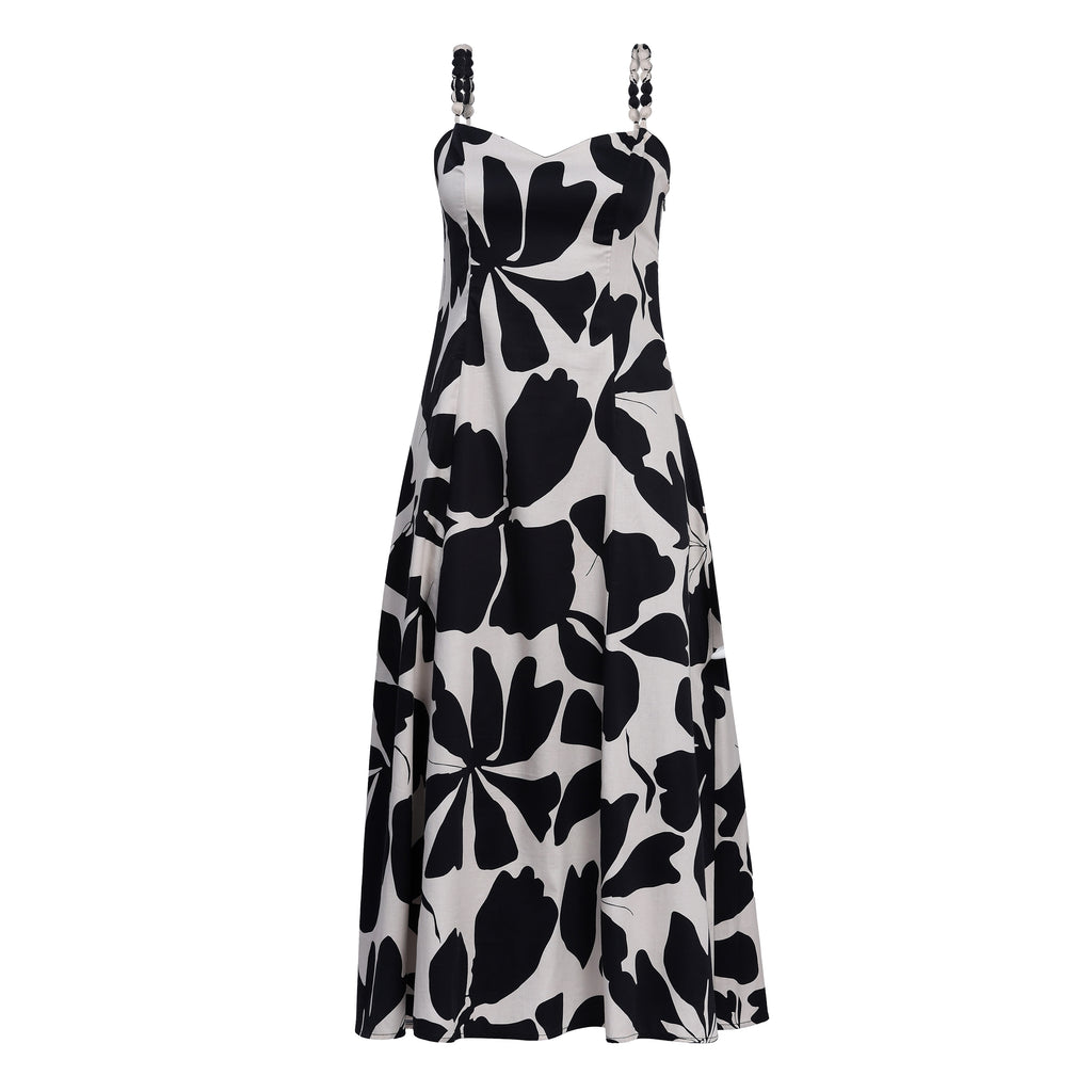 Black and white floral patterned dress on a white background