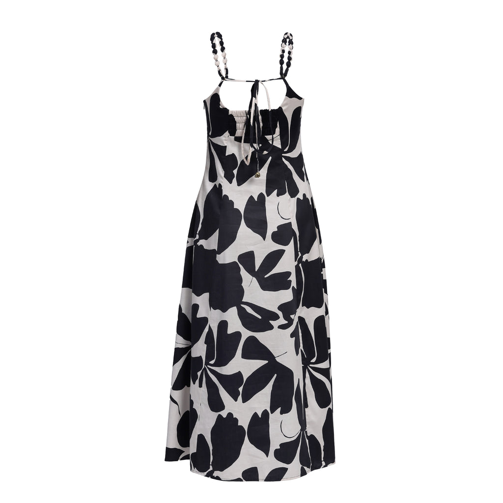 Black floral patterned dress on a white background