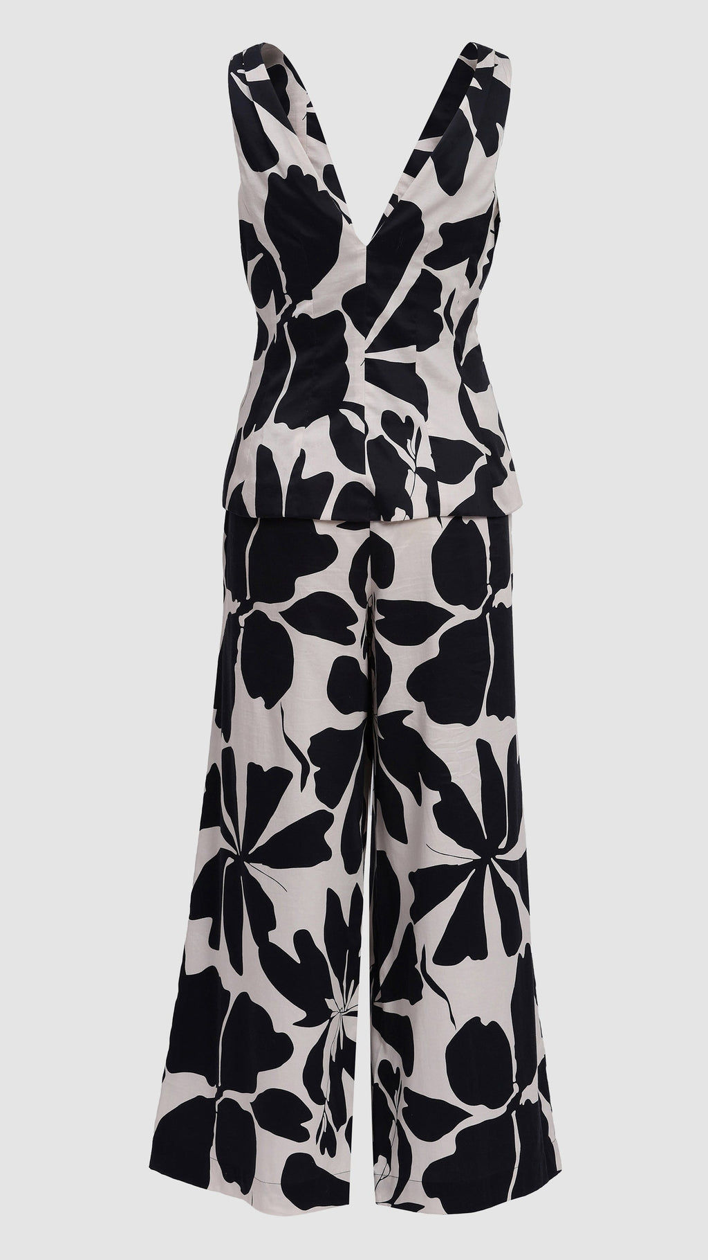 Black floral patterned jumpsuit on a light gray background