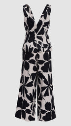 Black floral patterned jumpsuit on a light gray background