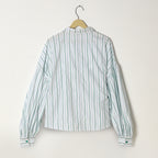 Striped shirt on a hanger against a white background